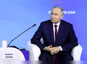 Putin says Russia's economy is growing despite heavy international sanctions as he courts investors