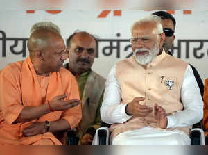 Meerut: Prime Minister Narendra Modi with UP Chief Minister Yogi Adityanath duri...