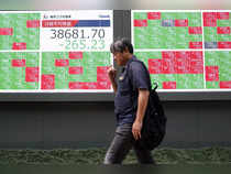 Japan's Nikkei edges up as financials, export shares rise