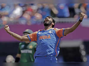India's Jasprit Bumrah celebrates the dismissal of Pakistan's captain Babar Azam...