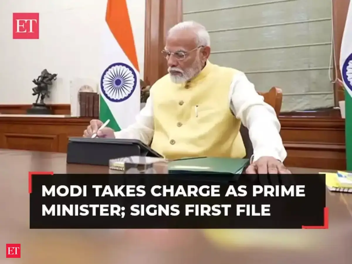 Narendra Modi takes charge as Prime Minister; signs first file for farmers' welfare - The Economic Times Video | ET Now