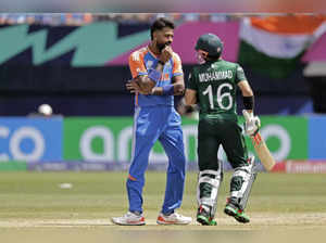 India's Hardik Pandya, left, interacts with Pakistan's Mohammad Rizwan during th...