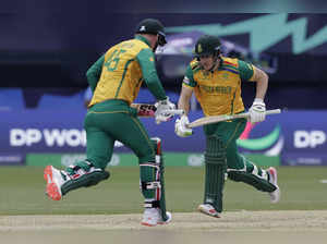 South Africa's David Miller, right, and Heinrich Klaasen run between the wickets...