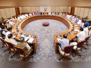 This handout photograph taken and released on June 10, 2024 by the Indian Press Information Bureau (PIB) shows India's Prime Minister Narendra Modi (C) holding the first cabinet meeting, in New Delhi.