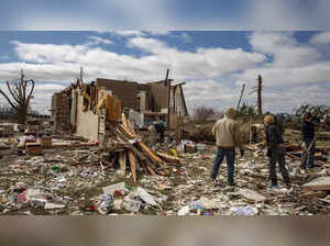 At least 26 dead after tornadoes rake US Midwest, South