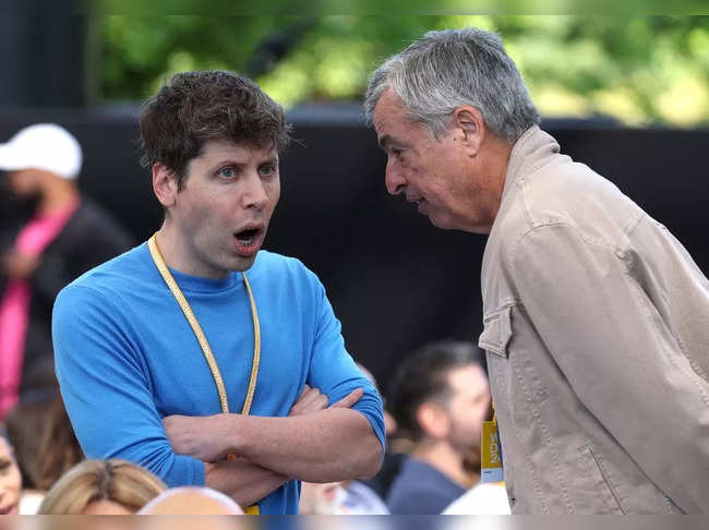 OpenAI CEO Sam Altman (L) talks with Apple senior Vice President of Services Eddy Cue (R) during the Apple Worldwide Developers Conference (WWDC) on June 10, 2024 in Cupertino, California.