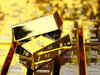 Gold pares gains on reduced rate cut bets after Fed verdict