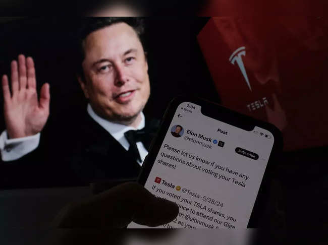This illustration image created on June 12, 2024 in Los Angeles, shows South African businessman Elon Musk’s campaign launched on X ahead of Tesla shareholders meeting in front of his picture on a screen.