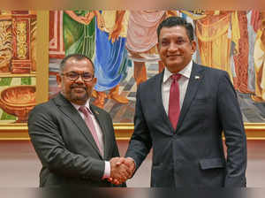 Sri Lanka's Foreign Minister Ali Sabry (R) shakes hands with Maldives' Foreign Minister Moosa Zameer after a joint press conference in Colombo on June 5, 2024.