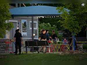 Police investigate the scene of a shooting at the Brooklands Plaza Splash Pad on June 15, 2024 in Rochester Hills, Michigan.