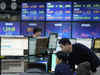 Asian shares mostly lower as China reports factory output slowed