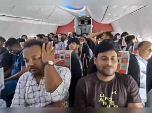 **EDS: VIDEO GRAB** New Delhi: Passengers onboard a Spicejet flight in which the...