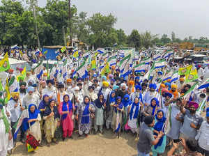 Gurdaspur: Farmers stage a protest after they were stopped from marching towards...