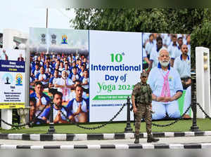 A security personnel stands guard before the arrival of India's Prime Minister Narendra Modi outside Sher-i-Kashmir International Conference Centre (SKICC) in Srinagar on June 20, 2024 on the eve of International Yoga Day.