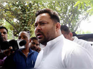 Patna: RJD leader Tejashwi Yadav interacts with the media before leaving for Del...