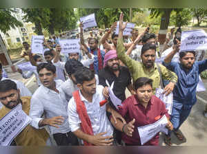 Lucknow: Students during a protest against the Central Government over the cance...
