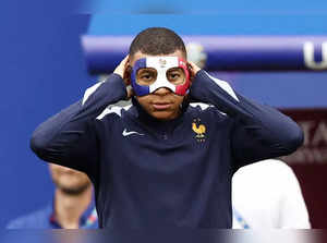 France's forward #10 Kylian Mbappe wears a face mask as he takes part in a MD-1 training session at the Leipzig Stadium in Leipzig on June 20, 2024, on the eve of their UEFA Euro 2024 Group D football match against Netherlands.