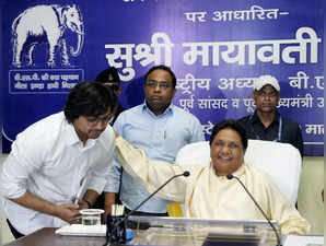 Lucknow: BSP supremo Mayawati with her brother Anand Kumar and nephew Akash Anan...