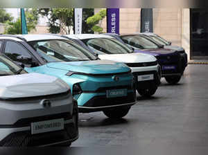 Tata Motors' Nexon and the electric vehicle Nexon.ev are seen parked for display outside a hotel ahead of its launch in New Delhi