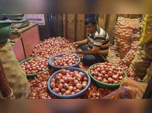 Thane: A man sorts onions at a market in Thane. Onion prices are expected to go ...