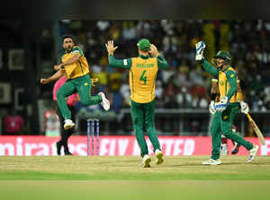 South Africa's Tabraiz Shamsi celebrates with teammates after the dismissal of West Indies' Sherfane Rutherford during the ICC men's Twenty20 World Cup 2024 Super Eight cricket match between West Indies and South Africa at Sir Vivian Richards Stadium in North Sound, Antigua and Barbuda on June 23, 2024.