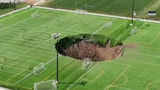 What happened in Illinois that a 100-foot-wide sinkhole appeared and smoke plumes were released?