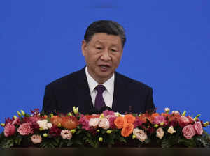 Chinese President Xi Jinping delivers his speech at a conference marking the 70t...