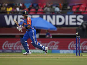 India's Virat Kohli watches the ball after playing a shot during the ICC Men's T...