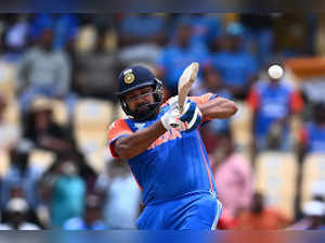 India's captain Rohit Sharma hits a 4 during the ICC men's Twenty20 World Cup 2024 Super Eight cricket match between Australia and India at Daren Sammy National Cricket Stadium in Gros Islet, Saint Lucia on June 24, 2024.