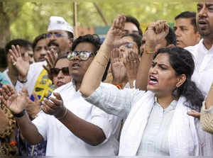 New Delhi: Members of AAP youth and student's wing stage a protest against the a...