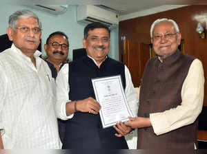 Patna, Feb 20 (ANI): Bihar Chief Minister Nitish Kumar holds a certificate after...