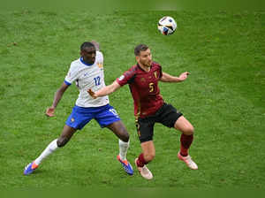 France's forward #12 Randal Kolo Muani fights for the ball with Belgium's defender #05 Jan Vertonghen during the UEFA Euro 2024 round of 16 football match between France and Belgium at the Duesseldorf Arena in Duesseldorf on July 1, 2024.