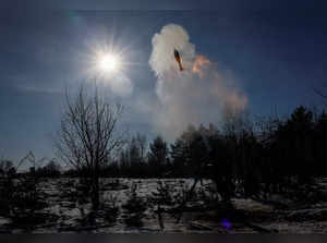 Ukrainian servicemen fire a 120-mm mortar during military exercises in Zhytomyr region