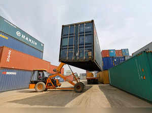 A mobile crane carries a container at Thar Dry Port in Sanand in the western state of Gujarat, India
