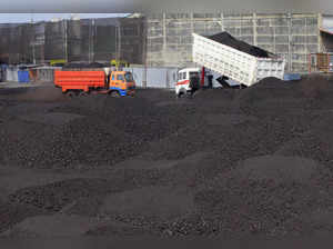 FILE PHOTO: A truck unloads coal inside a warehouse in Tondo city, metro Manila