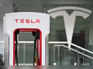 A Tesla electric vehicle charging stall stands at a Tesla Supercharger location in Santa Monica, California on May 15, 2024.