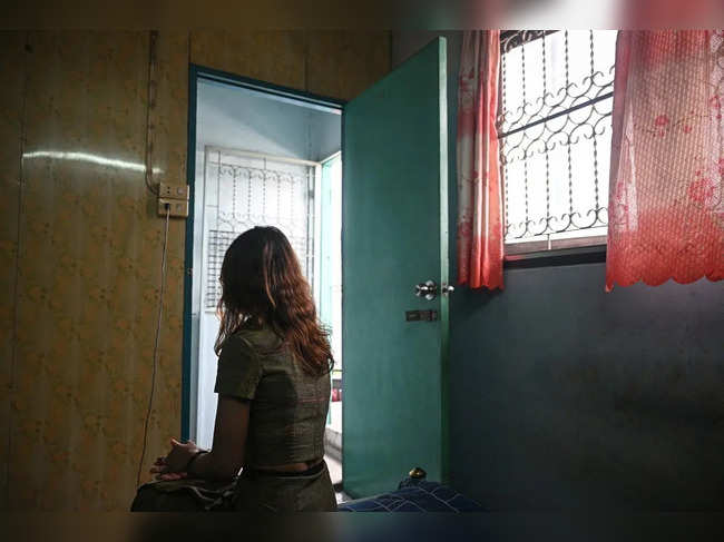 This photo taken on June 4, 2024 shows "Khaing," a former teacher with the Civil Disobedience Movement (CDM), speaking to AFP about fleeing from Myanmar to Thailand to avoid conscription by Myanmar's military junta, at her current home in Bangkok.