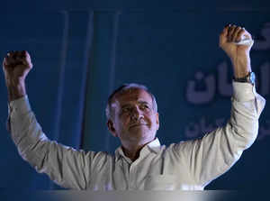 Reformist candidate for the Iran's presidential election Masoud Pezeshkian clenc...
