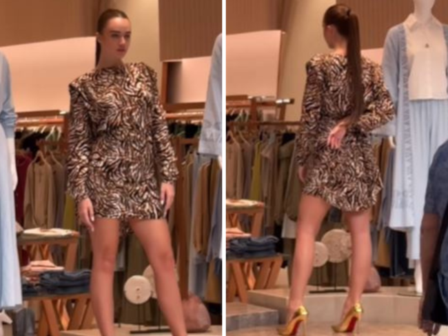 Model posing as live mannequin at Dubai mall storefront