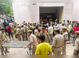 Etah: Police personnel outside a hospital where victims of the Hathras' stampede...