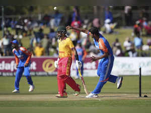 India's bowler Washington Sundar, right, bowls during the T20 cricket match agai...