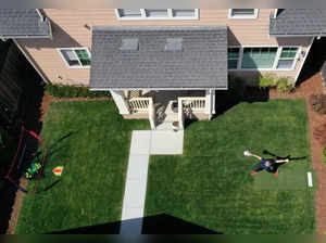 In this aerial view from a drone, Olympic softball pitcher Monica Abbott practices in her backyard during a training session on June 02, 2020 in Salinas, California.