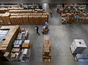 FILE PHOTO: Workers at supply management company Prozo's distribution warehouse near Gurugram, India