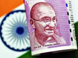 Rupee ends weaker, pressured by state-run banks' dollar bids; eye on US inflation