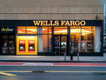 Wells Fargo profit falls on deposit costs