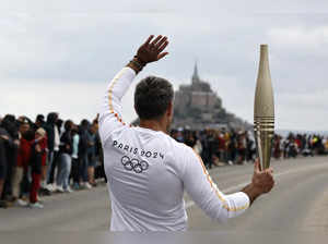 France's Bastille Day parade meets the Olympic torch relay in an exceptional year