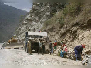 FILE PHOTO: Labourers work on India's Tezpur-Tawang highway which runs to the Chinese border in the northeastern Indian state of Arunachal Pradesh