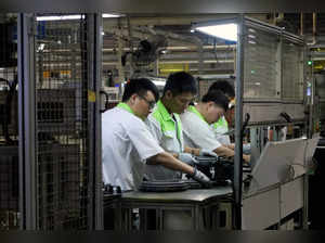 Workers at Valeo Kapec auto parts factory in Nanjing