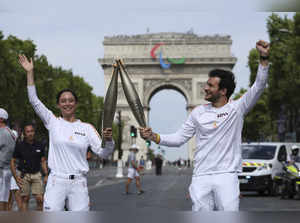 Who is carrying the Olympic torch through Paris? A BTS star, a garbage collector and more