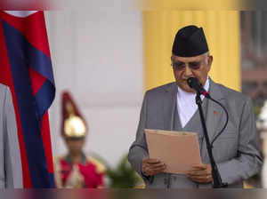 Newly elected Prime Minister Khadga Prassad Oli is being sworn by president Ram ...